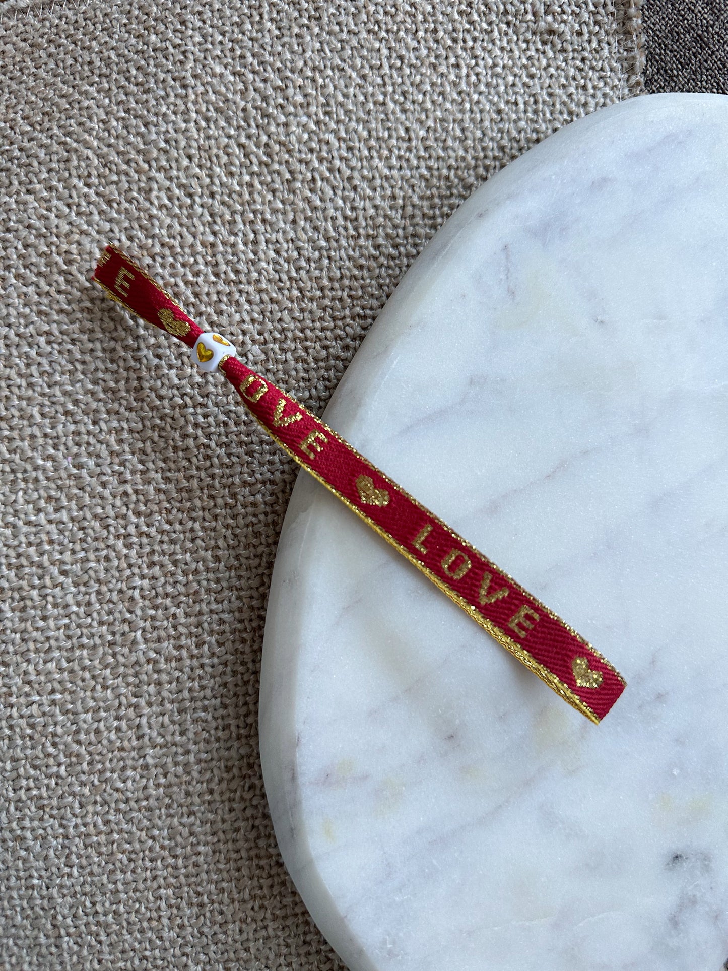 Lintbandje- goud/rood